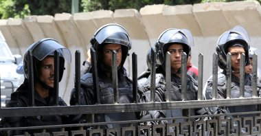 Riot police stand in front of parliament as high school students take part in a protest against the cancellation and postponement of exams after a series of exam leaks, in Cairo, Egypt, June 27, 2016. (Reuters Photo)