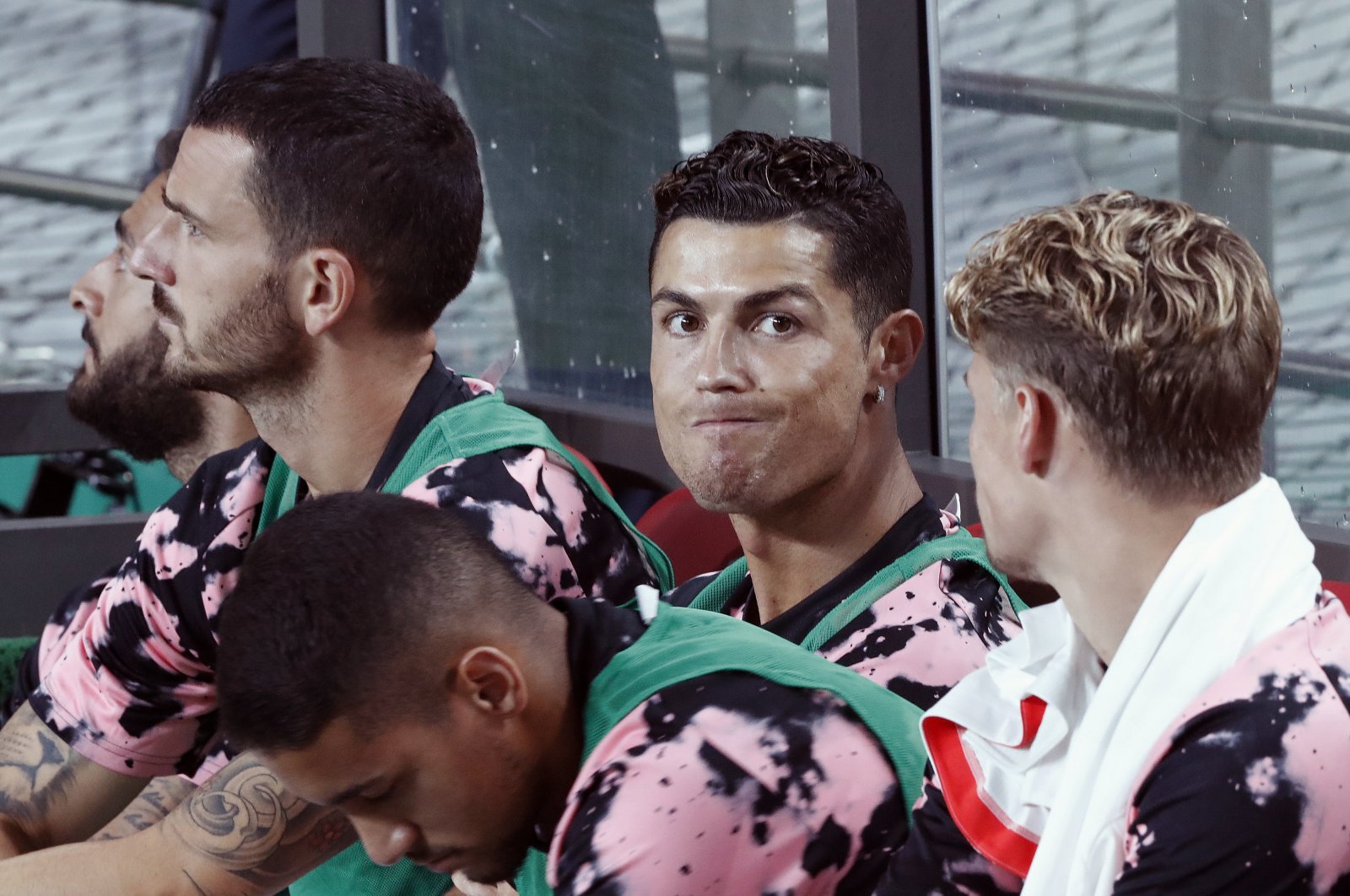 Cristiano Ronaldo (C) sits on the bench during the friendly match in Seoul, South Korea, July 26, 2019. (AP Photo)