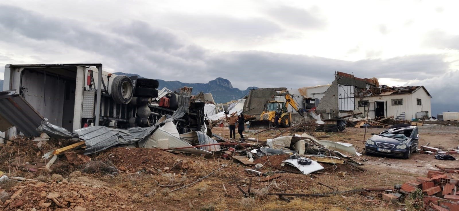 Damaged buildings and vehicles are seen in the aftermath of a tornado, in the Girne district, the Turkish Republic of Northern Cyprus (TRNC), Nov. 21, 2020. (IHA Photo)