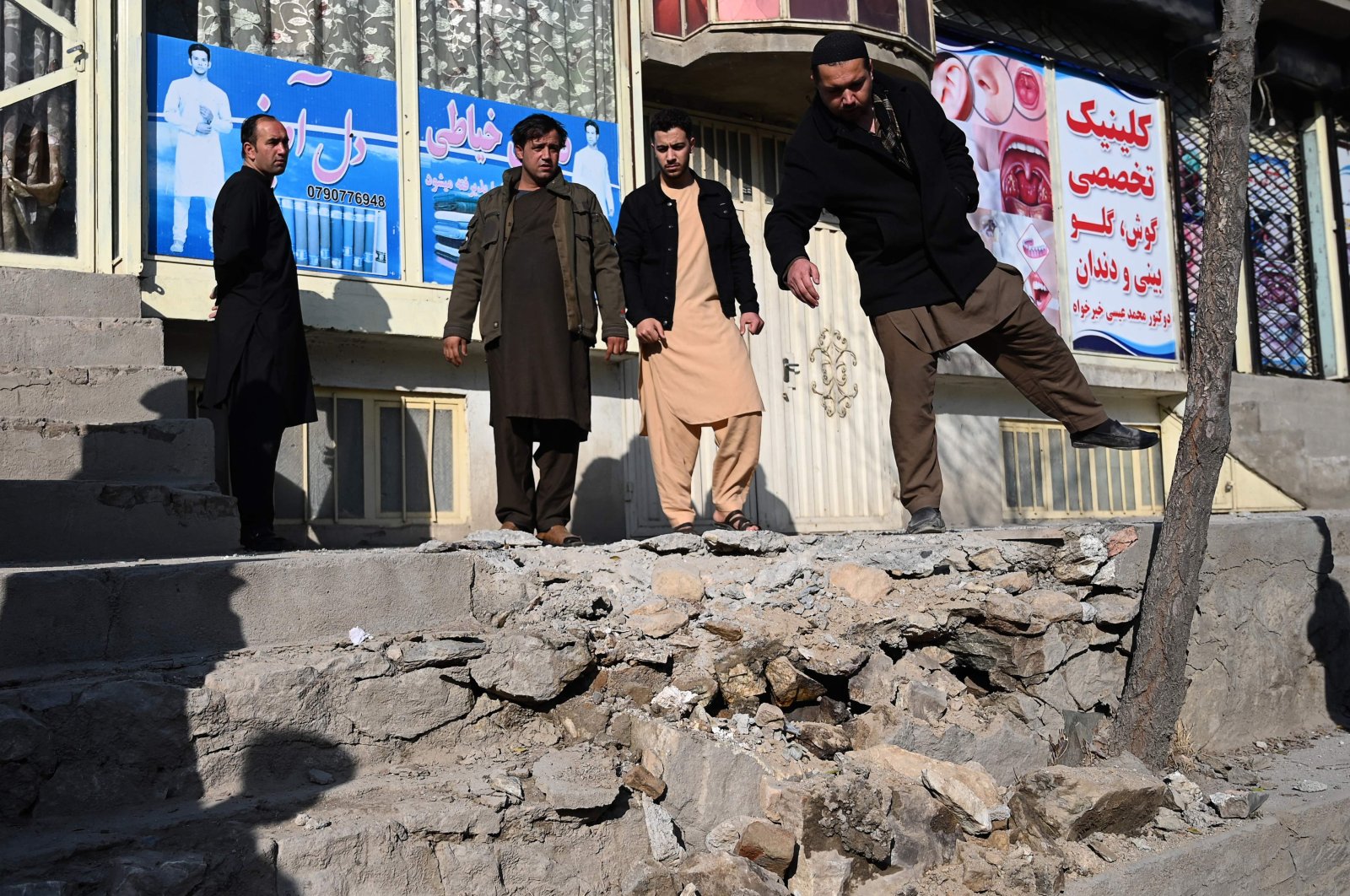 People gather at a site of a rocket attack at Khair Khana, northwest of Kabul, Afghanistan, Nov. 21, 2020. (AFP Photo)