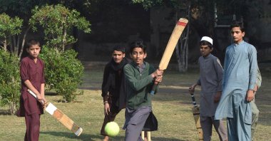 Pakistani youth play cricket at a playground in Lahore, Pakistan, Nov. 19, 2020. (AFP Photo) 