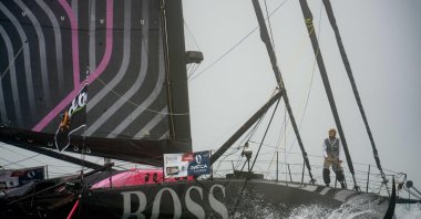 Alex Thomson walks on the deck of Hugo Boss off Vendee, France, Nov. 8, 2020.  (AFP Photo)