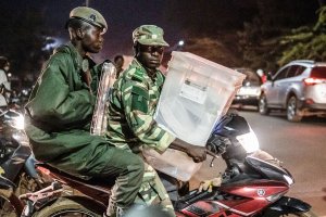 Security forces leave a city hall where the Independent National Electoral Commission (CENI) distributes electoral material to polling station directors and members with a polling box on the eve of the presidential election in the capital Ouagadougou, Burkina Faso, Nov. 21, 2020. (Photo by OLYMPIA DE MAISMONT / AFP)