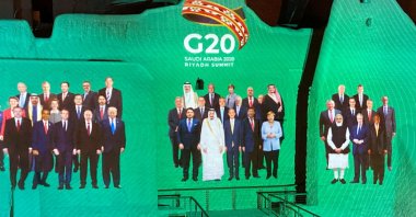 The "Family Photo" for the annual G-20 world leader's summit is projected onto Salwa Palace in At-Turaif, one of Saudi Arabia's UNESCO World Heritage sites, in Diriyah, Saudi Arabia, Nov. 20, 2020. (REUTERS Photo)