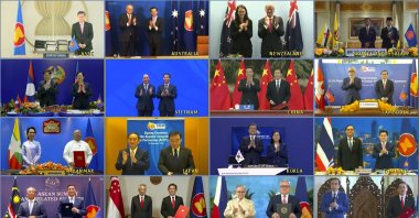 The leaders and trade ministers of the 15 Regional Comprehensive Economic Partnership (RCEP) countries pose for a virtual group photo, Nov. 15, 2020. (AP Photo)