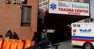 People wearing protective face masks, as the global outbreak of the coronavirus disease continues, wait in line at a mobile COVID-19 testing unit at Elmhurst Hospital in the Queens borough of New York, U.S., Nov. 19, 2020. (REUTERS Photo)