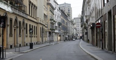 A view of a deserted street in downtown Milan amid the coronavirus locdown, Milan, Italy, March 12, 2020. (AP Photo)