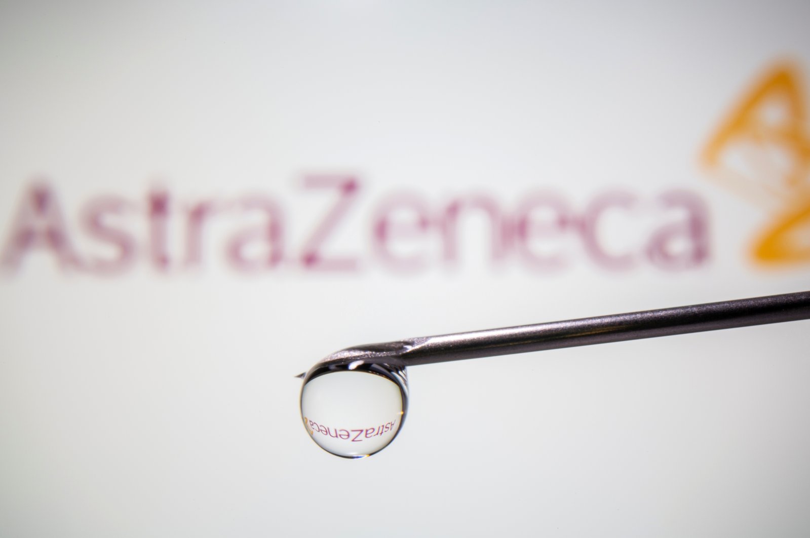 AstraZeneca's logo is reflected in a drop on a syringe needle in this illustration taken Nov. 9, 2020. (Reuters Photo)