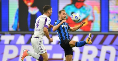 Inter Milan's Christian Eriksen (R) in action with Fiorentina's Nikola Milenkovic, in Milan, Italy, Sept. 26, 2020. (REUTERS Photo) 