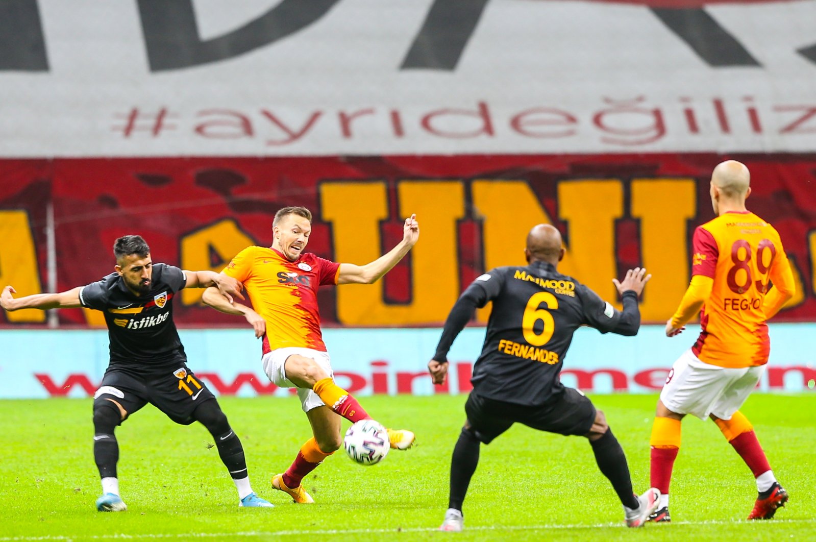 Muğdat Çelik (L) in action against Galatasaray's Martin Linnes (2nd L) during the match in Istanbul, Turkey, Nov. 24, 2020. (AA Photo)
