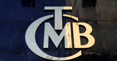 A logo of the Central Bank of the Republic of Turkey (CBRT) is displayed at the entrance of the bank's headquarters in the capital Ankara, April 19, 2015. (Reuters Photo)
