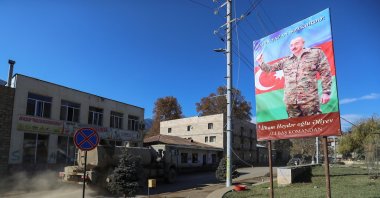 A board with an image of Azerbaijani President Ilham Aliyev is on display in Hadrut town, which recently came under the control of Azerbaijan's troops following a military conflict against Armenian forces and a further signing of a cease-fire deal, in the region of Nagorno-Karabakh, Nov. 25, 2020. (REUTERS)