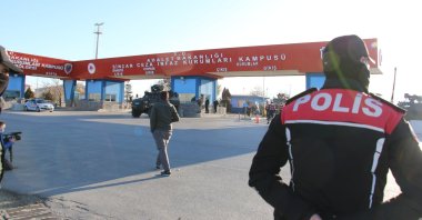 A police officer stands guard at the entrance of the courthouse-prison complex where the trial was held, in the capital Ankara, Turkey, Nov. 26, 2020. (IHA Photo)
