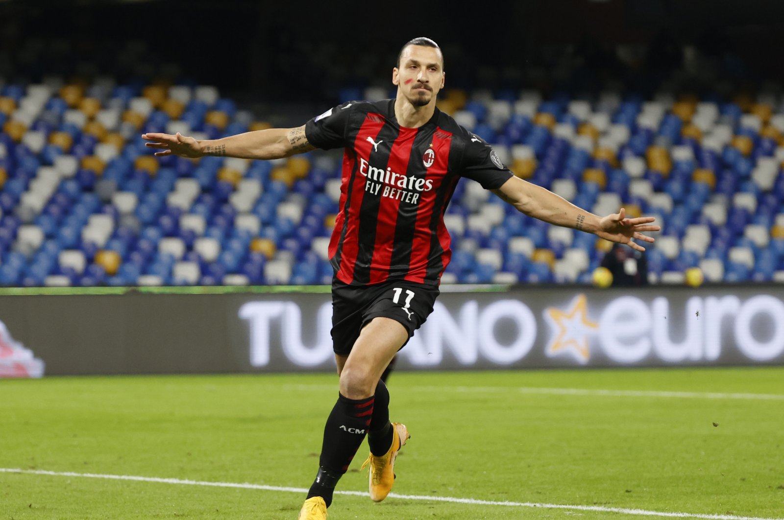 AC Milan’s Zlatan Ibrahimovic celebrates after scoring his team’s first goal against Napoli while wearing red face paint to raise awareness of domestic violence against women, Naples, Italy, Nov. 22, 2020. (Reuters Photo)