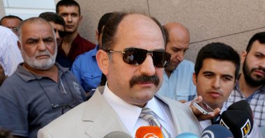 Zekeriya Öz, a former prosecutor wanted for his links to the Gülenist Terror Group (FETÖ), speaks to reporters outside a courthouse in Istanbul, Turkey, Aug. 6, 2014. (AA Photo)