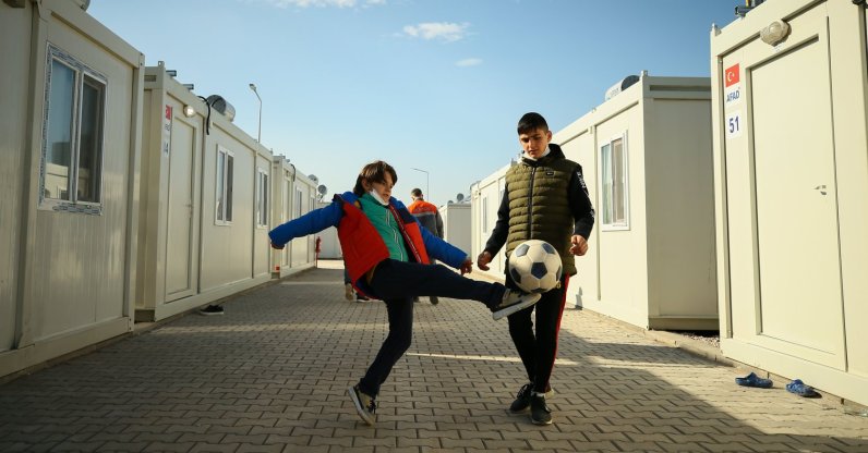 Children play football in an alley between housing units, in Izmir, western Turkey, Nov. 26, 2020. (AA Photo) 