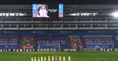 Players applaud as a mark of respect for Diego Maradona ahead of the Premier League match between Crystal Palace and Newcastle United, in London, Britain, Nov. 27, 2020. (AP Photo)