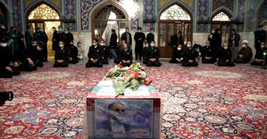 A handout picture provided by the Iranian defense ministry shows family members and officials praying over the coffin of slain Iranian nuclear scientist Mohsen Fakhrizadeh inside the Shrine of Imam Reza, during a funeral ceremony in the city of Mashhad, northeastern Iran, Nov. 29, 2020. (EPA Photo)