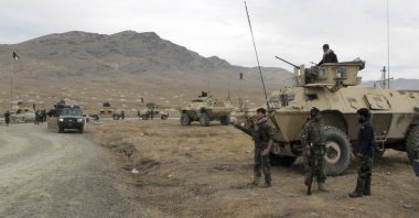 Afghan national army soldiers arrive at the site of a suicide bombing in Ghazni province west of Kabul, Afghanistan, Sunday, Nov. 29, 2020. (AP Photo)