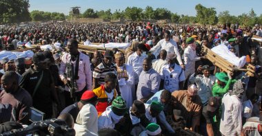 Mourners attend the funeral of 43 farm workers in Zabarmari, about 20 kilometers from Maiduguri, Nigeria, on Nov. 29, 2020, after they were killed by Boko Haram fighters in rice fields near the village of Koshobe on Nov. 28, 2020. (AFP Photo)