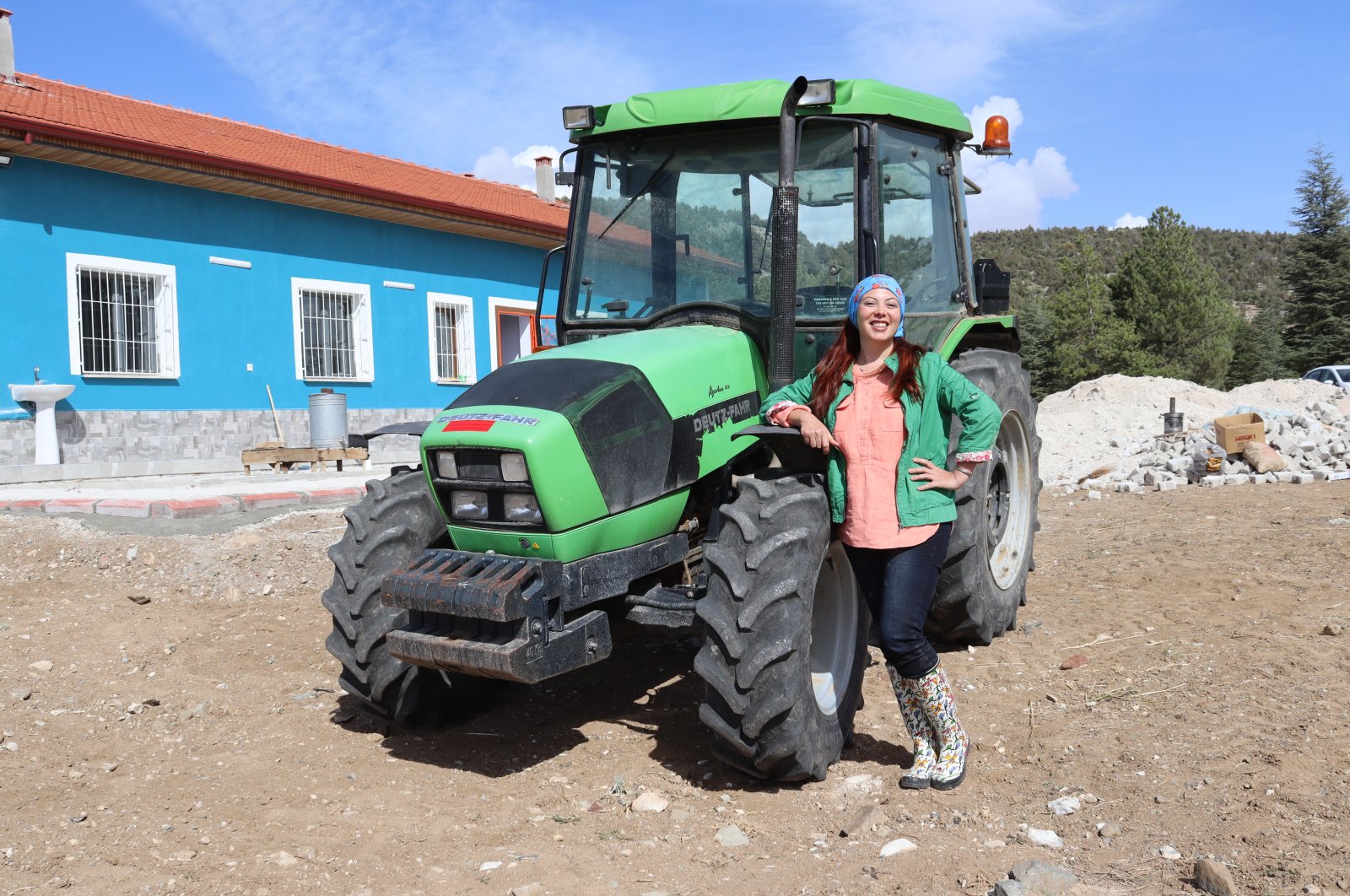Aynur Onur poses for a photo near her tractor in her hometown Burdur, southwestern Turkey, Nov. 27, 2020. (AA Photo)