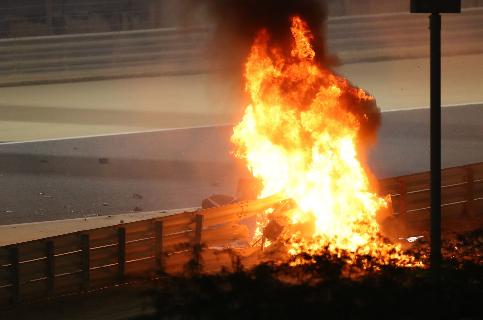 Haas driver Romain Grosjean's car burns after an accident at the Formula 1 Bahrain Grand Prix at the Bahrain International Circuit, in Sakhir, Bahrain, Nov. 29, 2020. (AFP Photo)
