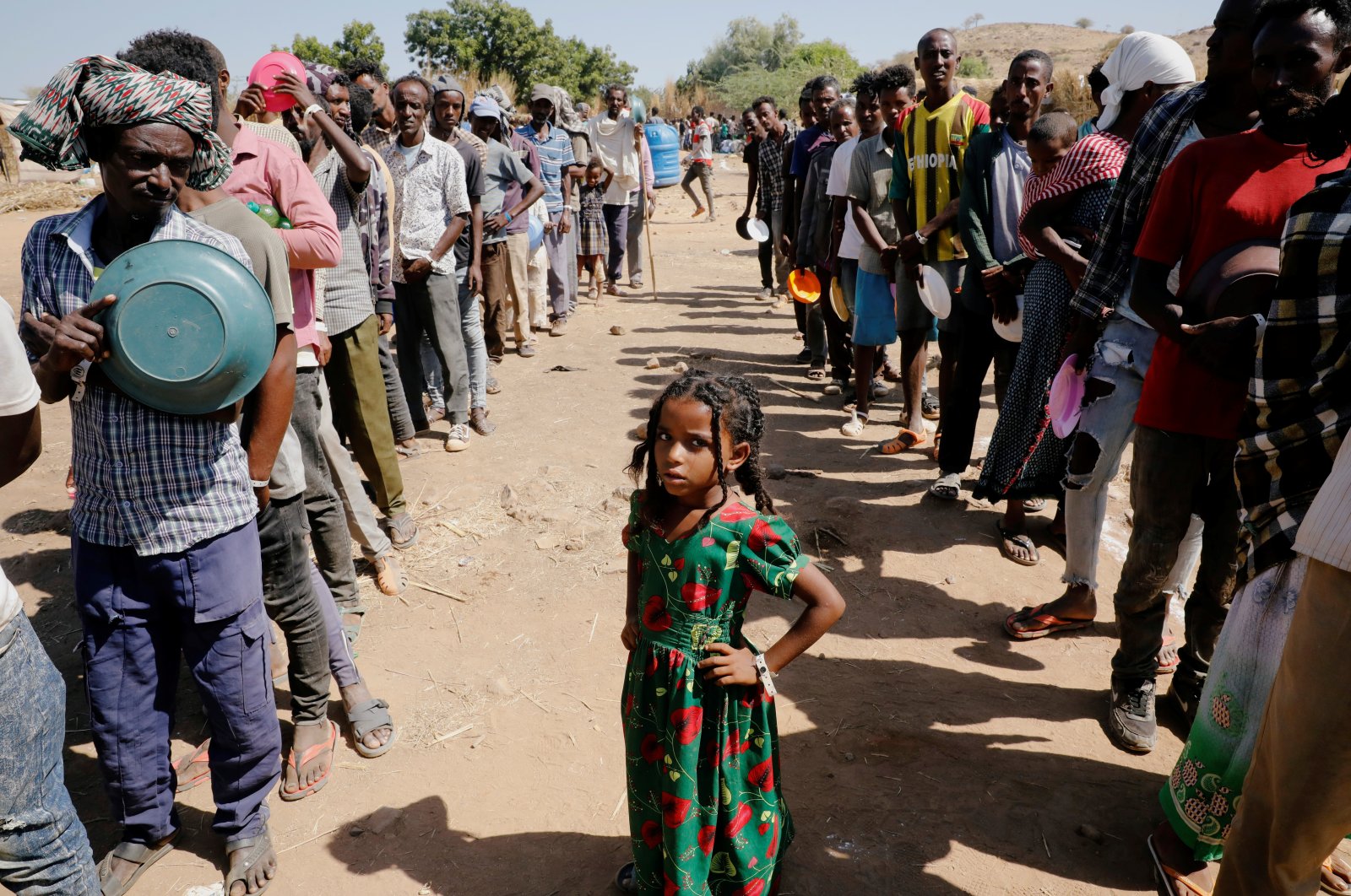 Ethiopian refugees wait in lines for a meal at the Um Rakuba refugee camp which houses Ethiopian refugees fleeing the fighting in the Tigray region, on the Sudan-Ethiopia border, Sudan, Nov. 28, 2020. (Reuters Photo)