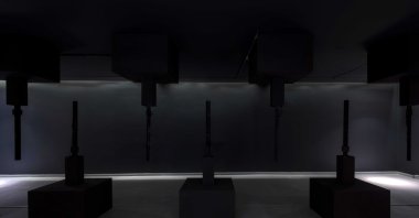 "If These Walls Could Hush" comprises of a configuration of nine poles resembling stalactites and stalagmites in a cave, at Zilberman Gallery, Istanbul, Turkey. (Courtesy of Zilberman Gallery)