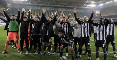 Beşiktaş players celebrate their Süper Lig victory against Fenerbahçe in front of visitor stands at the Ülker Şükrü Saraçoğlu Stadium in Istanbul, Nov. 30, 2020. (AA Photo)