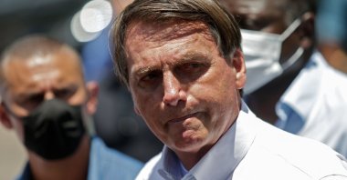 Brazilian President Jair Bolsonaro gestures as he speaks to the press after voting during the second round of municipal elections at the Rosa da Fonseca Municipal School, in the Military Village, Rio de Janeiro, Brazil, Nov. 29, 2020. (AFP Photo)