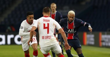 PSG's Neymar (R) duels for the ball with Leipzig's Willi Orban (C) and Justin Kluivert, during a Champions League match in Paris, France, Nov. 24, 2020. (AP Photo) 