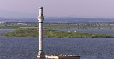 The minaret of an old mosque submerged under the Tahtalı Dam reservoir emerges after water levels receded, in Izmir, Turkey, Nov. 26, 2020. (IHA Photo)