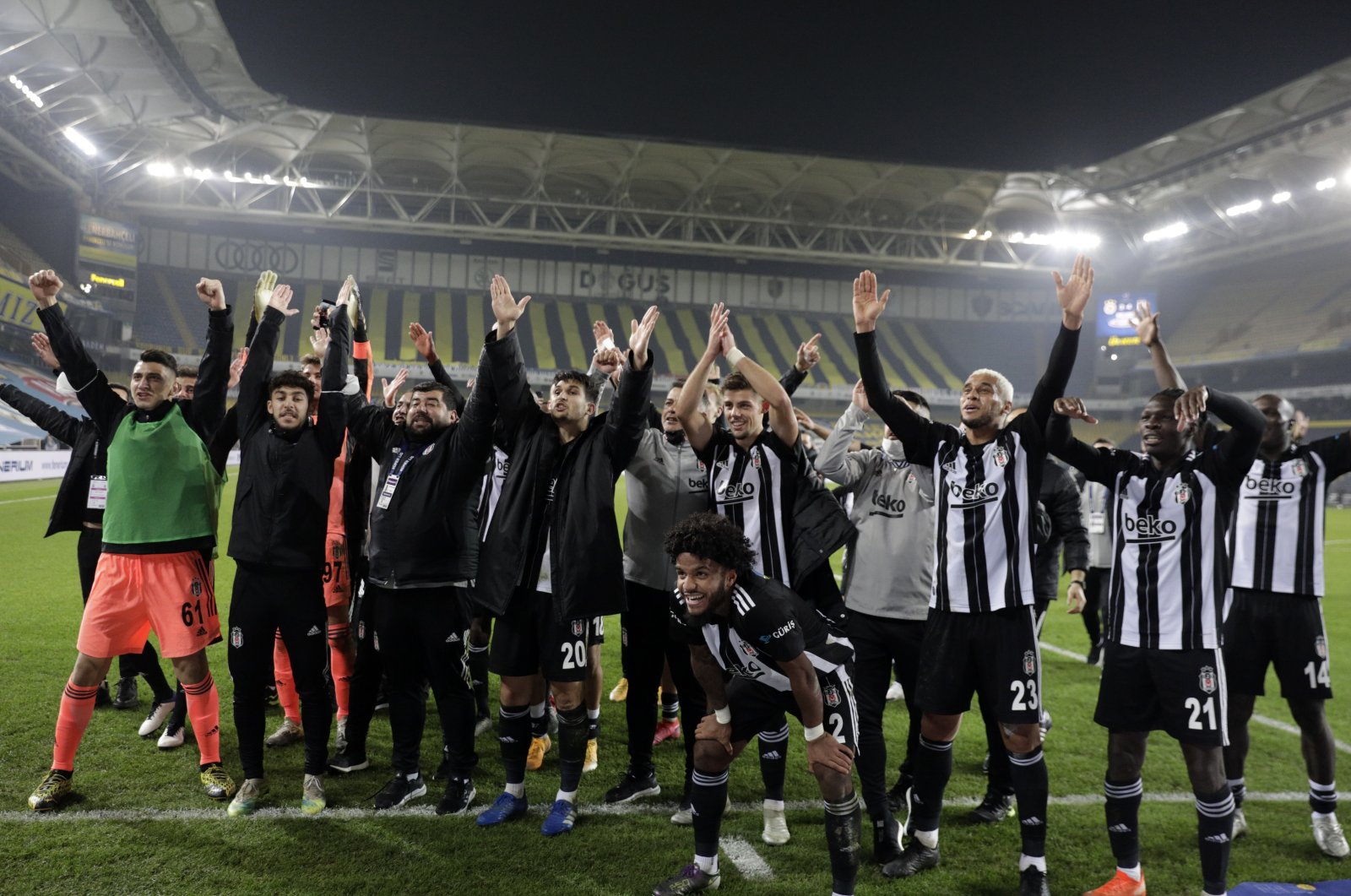 Beşiktaş players celebrate their Süper Lig victory against Fenerbahçe in front of visitor stands at the Ülker Şükrü Saraçoğlu Stadium in Istanbul, Nov. 30, 2020. (AA Photo)