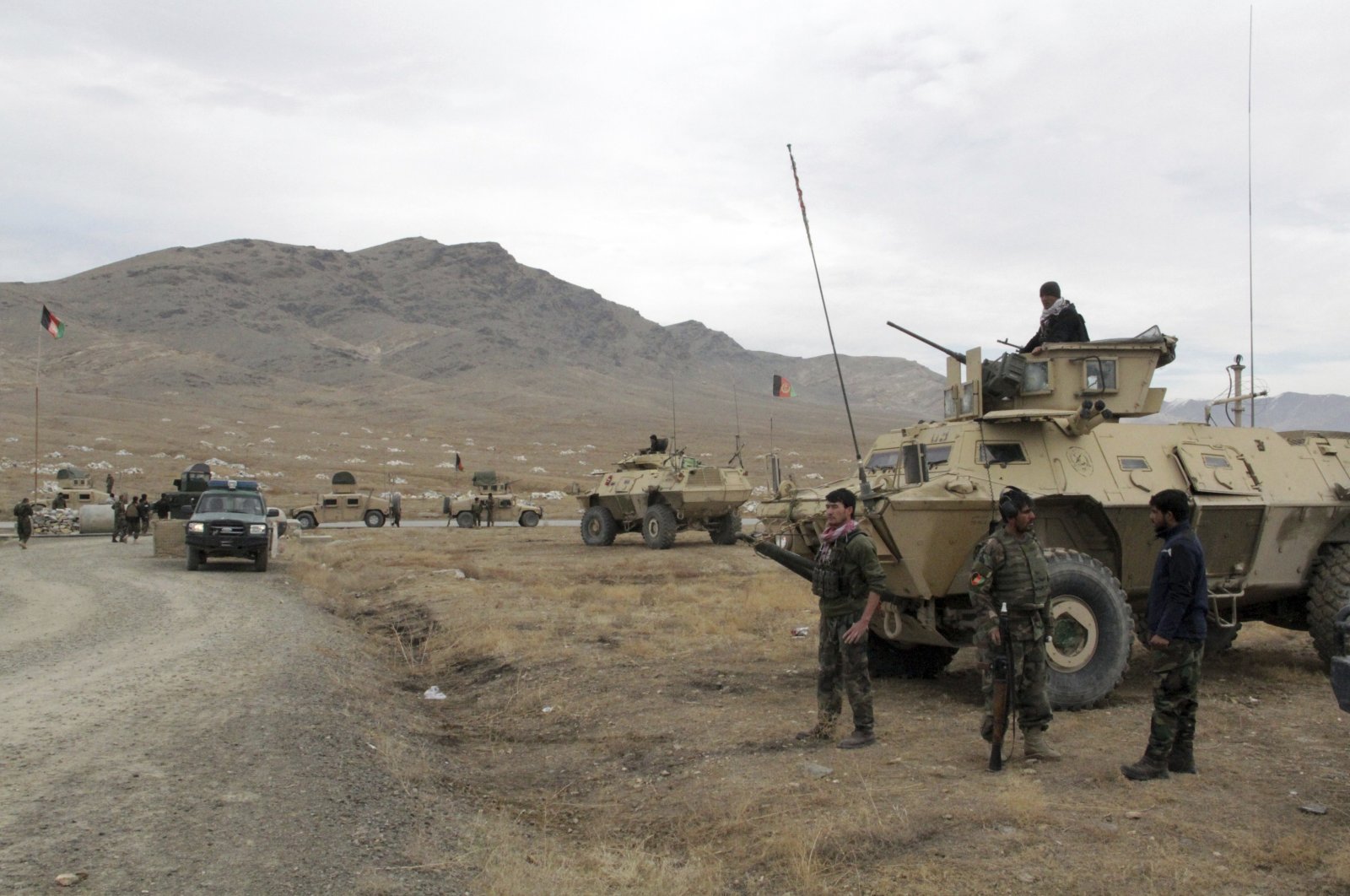 Afghan national army soldiers arrive at the site of a suicide bombing in Ghazni province west of Kabul, Nov. 29, 2020. (AP Photo)