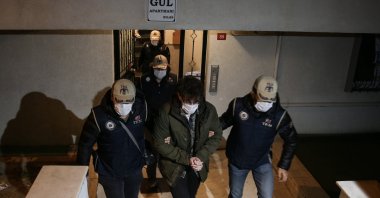 Police escort a suspect captured in an operation against FETÖ in Istanbul, Turkey, Nov. 30, 2020. (AA Photo) 