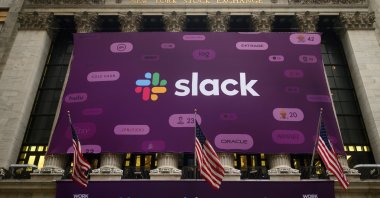 In this file photo taken on June 20, 2019, the logo of Slack Technologies Inc. adorns the New York Stock Exchange after the company's public offering. (AFP Photo)