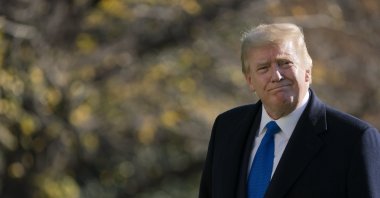 U.S. President Donald Trump walks on the South Lawn of the White House in Washington, Sunday, Nov. 29, 2020, after stepping off Marine One. (AP Photo)