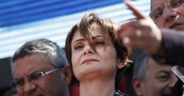 Canan Kaftancıoğlu, Turkey's opposition Republican People's Party (CHP) Istanbul provincial chairwoman is surrounded by supporters outside a court in Istanbul, Thursday, July 18, 2019. (AP File Photo)