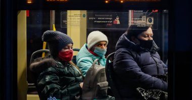 People wearing protective face masks ride on public transport during the coronavirus pandemic in Moscow, Russia, Nov. 27, 2020. (EPA Photo)