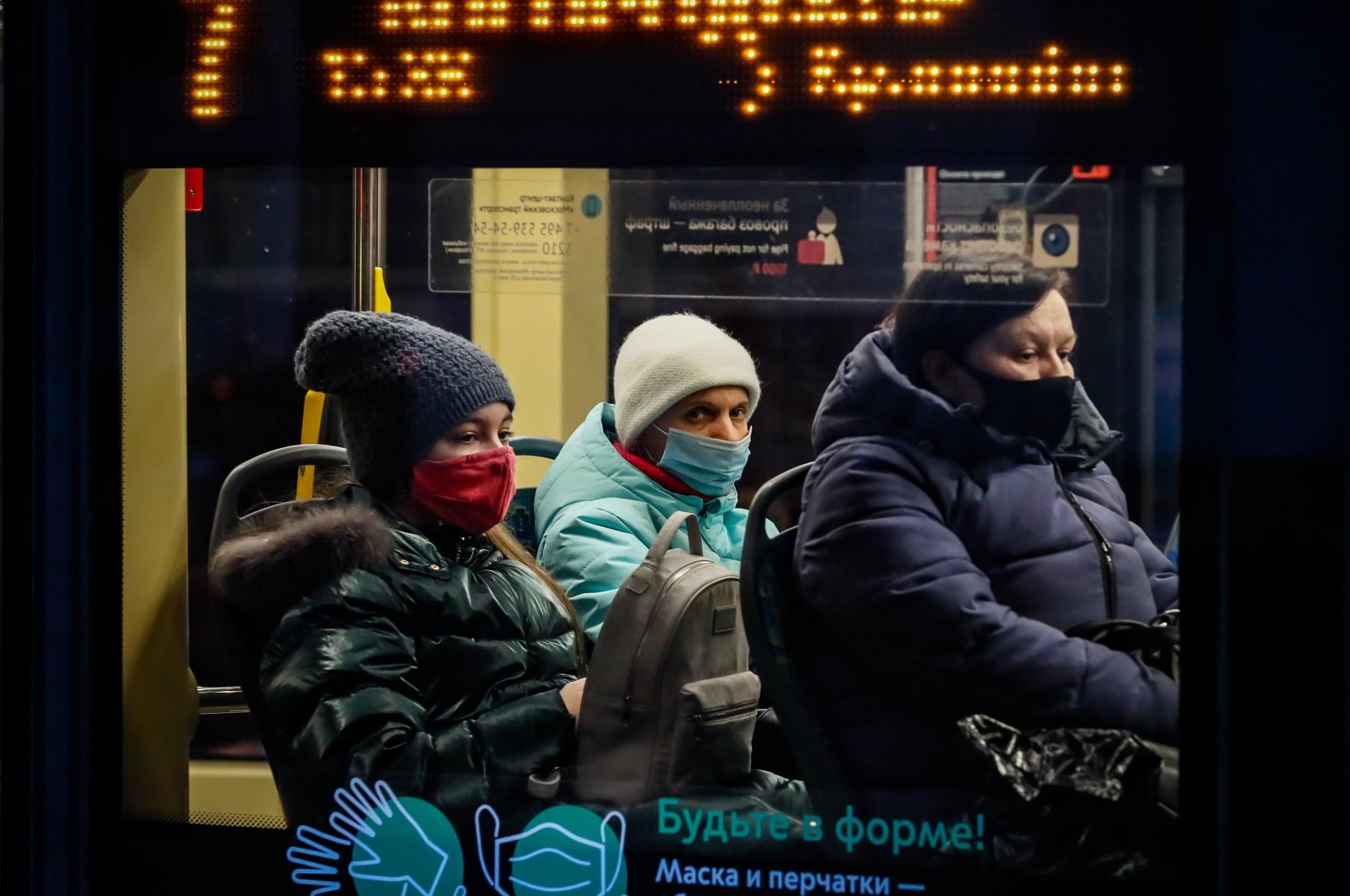 People wearing protective face masks ride on public transport during the coronavirus pandemic in Moscow, Russia, Nov. 27, 2020. (EPA Photo)