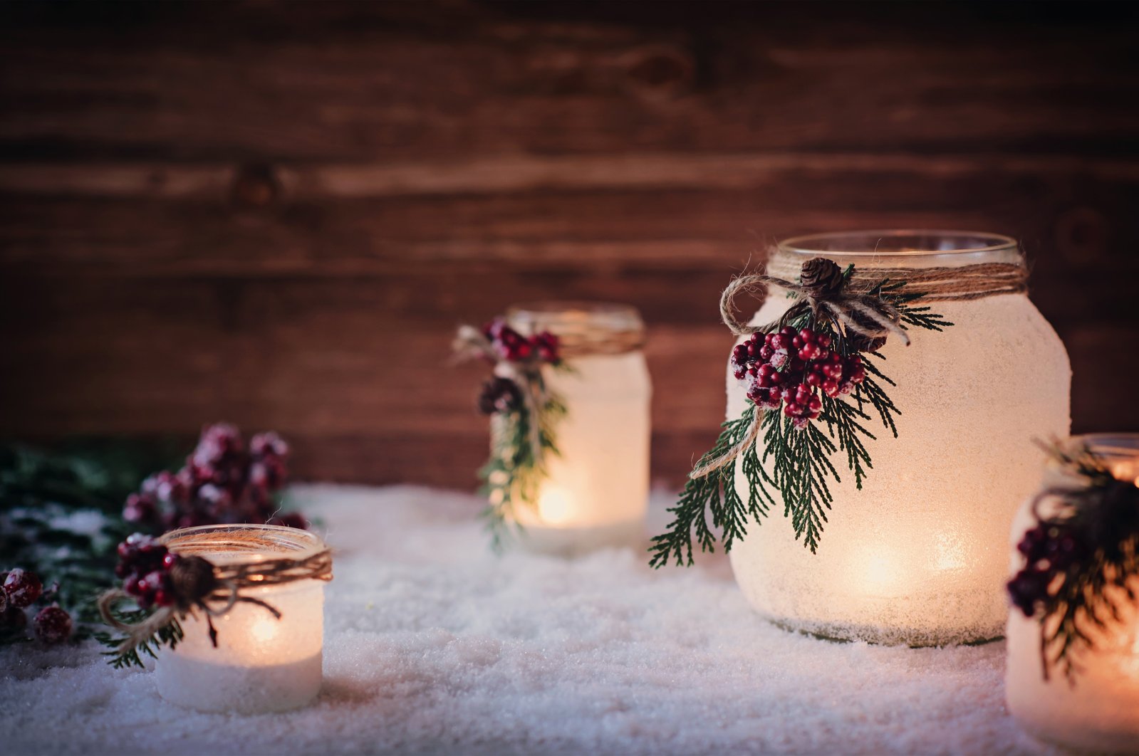 With some creativity and spray-on frost, you can create your own wintery frosty candles. (Shutterstock Photo)