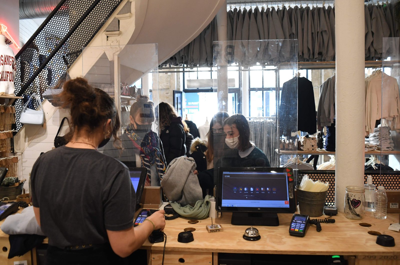 Customers shop in a clothing store after the French government eased COVID-19 lockdown measures and allowed all "nonessential" shops to reopen, Paris, France, Nov. 28, 2020. (AFP Photo)