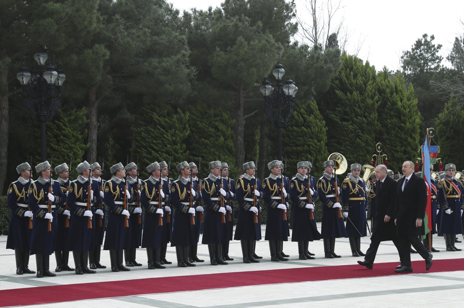 Turkish President Recep Tayyip Erdoğan (L) and Azerbaijan's President Ilham Aliyev inspect a military honor guard during a welcome ceremony, in Baku, Azerbaijan, Feb. 25, 2020. (AP Photo)