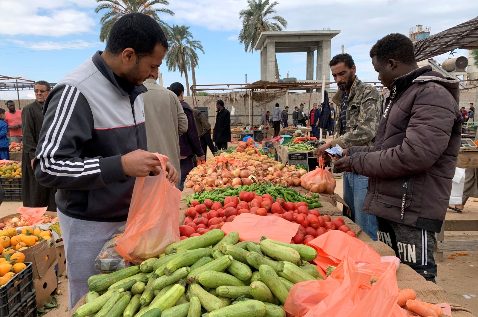 People buy vegetables from a market amid the coronavirus outbreak, in Misrata, Libya, Nov. 27, 2020. (Reuters Photo)