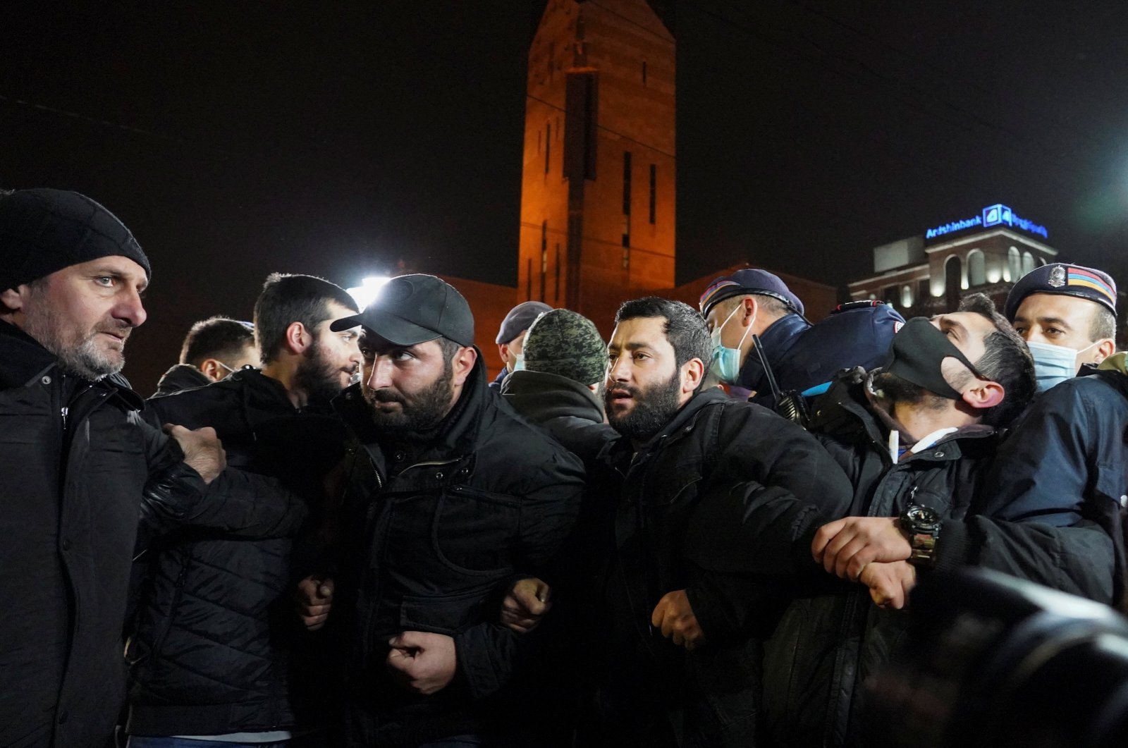 Participants attempt to block a street during an opposition rally to demand the resignation of Armenian Prime Minister Nikol Pashinian in Yerevan, Armenia, Dec. 3, 2020. (REUTERS Photo)