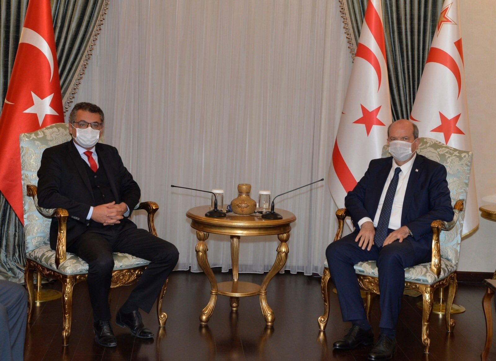 Turkish Republic of Northern Cyprus (TRNC) President Ersin Tatar (R) with Republican Turkish Party (CTP) Chairperson Tufan Erhürman (L) in Lefkoşa (Nicosia), TRNC, Dec. 3, 2020. (IHA Photo)