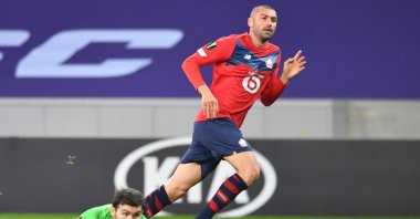 Lille forward Burak Yılmaz (R) watches his shot as he scores a goal during the UEFA Europa League Group H football match between Lille LOSC and Sparta Prague at the Pierre-Mauroy stadium in Villeneuve-d'Ascq, on the outskirts of Lille, northern France, Dec. 3, 2020. (AFP Photo)