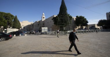 A man walks outside the Church of the Nativity, traditionally believed to be the birthplace of Jesus Christ, in the West Bank City of Bethlehem, Nov. 23, 2020. (AP Photo)