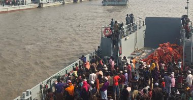 Rohingya refugees board a Bangladesh Navy ship to be transported to the island of Bhashan Char, in Chittagong, Bangladesh, Dec. 4, 2020. (AFP Photo)