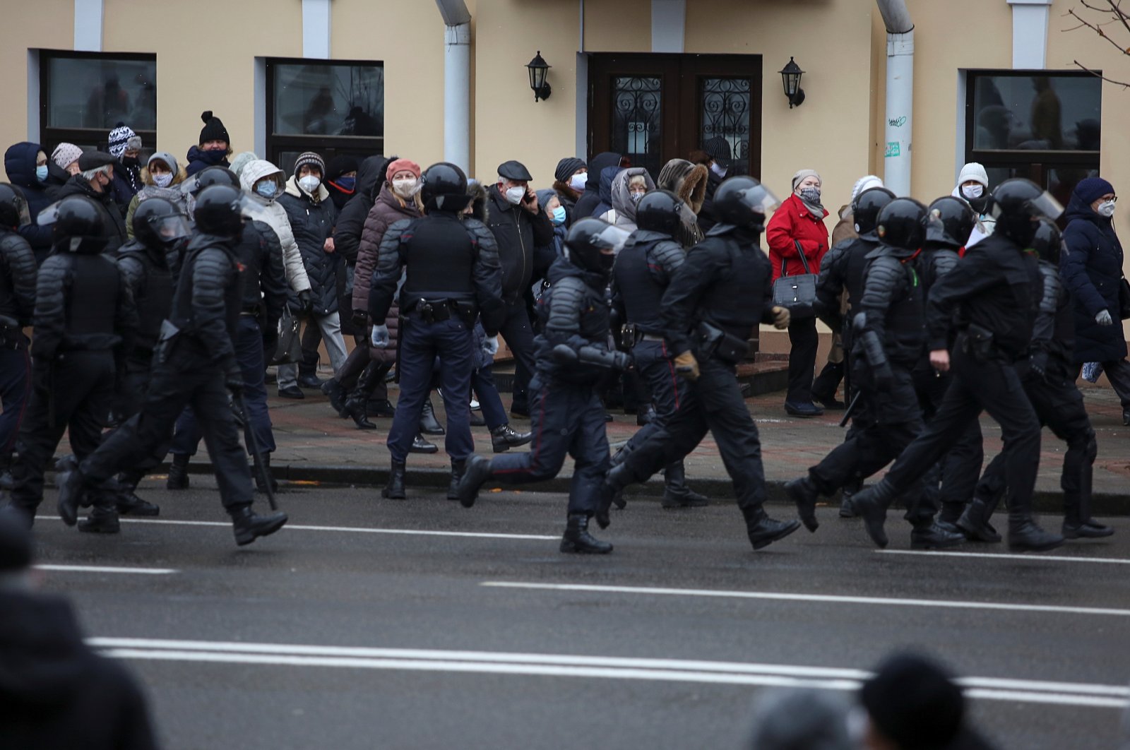 Belarusian law enforcement officers follow participants of an opposition rally, who demand the resignation of Belarusian President Alexander Lukashenko and protest against police violence, Minsk, Belarus, Nov. 30, 2020. (Reuters Photo)